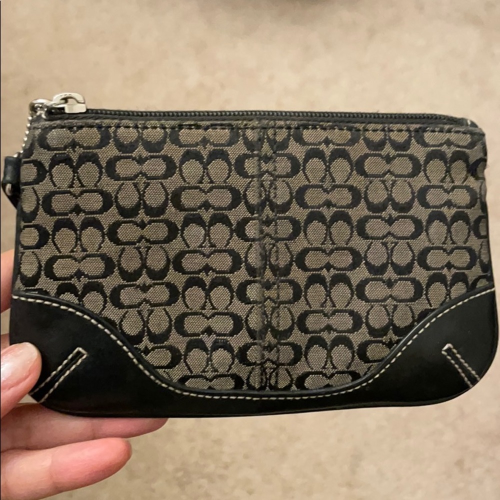 Black and grey Coach wristlet